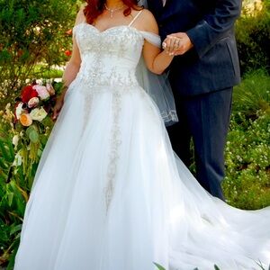 Stunning white wedding dress with lovely design embellishments.